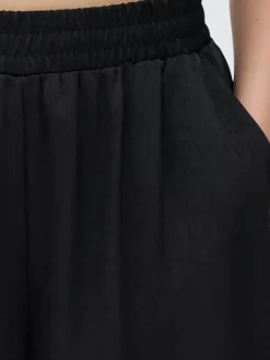 Primark Spodnie I Legginsy<Satynowe spodnie z szeroką nogawką The Edit